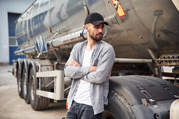 Young truck driver in casual clothes