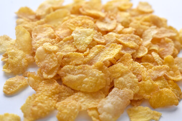 Crunchy cornflakes cereal on the table.  Healthy breakfast concept. 