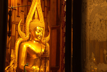 The large sitting golden Buddha image inside the church at Wat Pa Pathom Chai. Located at Nakhon Pathom Province in Thailand.
