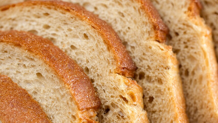 Fresh Sliced wheat bread. Texture of baked porous bread