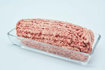 Raw meat ground into minced meat on a white background. Pork, beef or lamb. Different parts of meat products for different dishes.