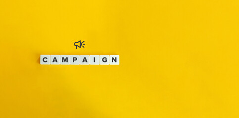 Campaign banner and conceptual image. Block letter tiles on bright orange background.