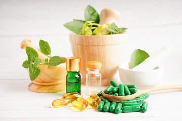 Alternative medicine herbal organic capsule with vitamin E omega 3 fish oil, mineral, drug with herbs leaf natural supplements for healthy good life.