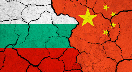 Flags of Bulgaria and China on cracked surface - politics, relationship concept