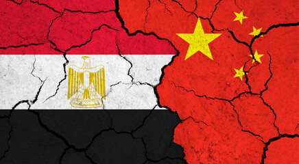 Flags of Egypt and China on cracked surface - politics, relationship concept
