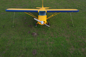 airplane carrying flying advertising banner parked on green grass © Vincenzo Rampolla