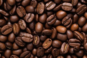 Fototapeta premium Fresh roasted coffee beans closeup pattern on dark background. Food pattern. Love coffee concept. Top view, flat lay with copy space