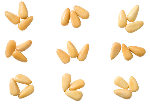 Roasted pine nuts isolated on the white background, top view.
