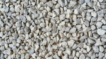 Top view of light grey gravel (Pebble) floor texture