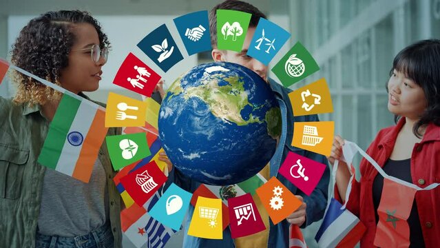 万国旗を持つ多国籍の人々とSDGsイメージ