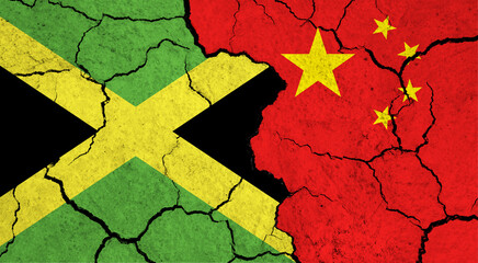 Flags of Jamaica and China on cracked surface - politics, relationship concept