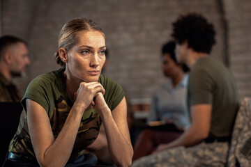 Portrait of female veteran in PTSD support group. - obrazy, fototapety, plakaty