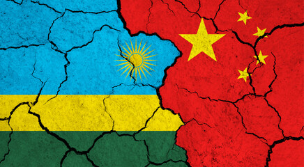 Flags of Rwanda and China on cracked surface - politics, relationship concept