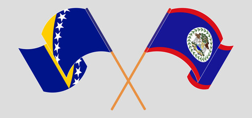 Crossed and waving flags of Bosnia and Herzegovina and Belize