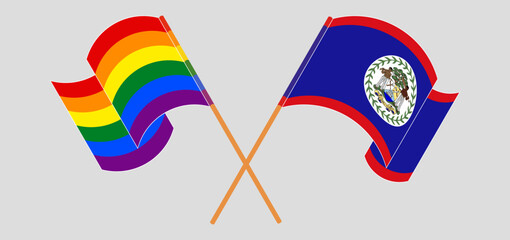 Crossed and waving flags of LGBTQ and Belize