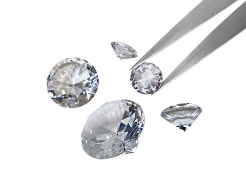 brilliant cut diamond held by tweezers transparent background
