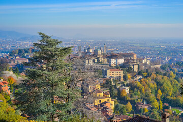 Italy, Bergamo, 14.10.2017: View of the city of Bergamo from the hill on a sunny day at sunset