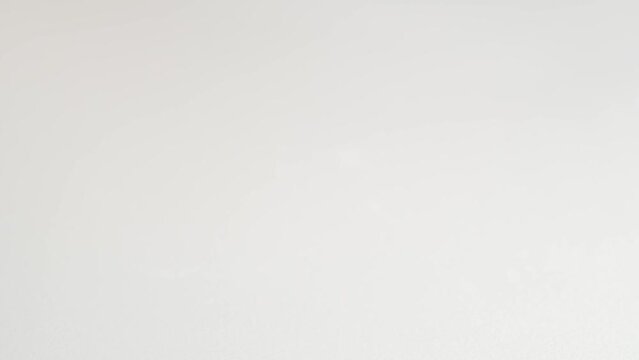 Woman taking two white pills into hand, makro. Two big white pills oval elongated shapes fall into palm of hand