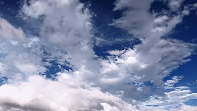 Fluffy white clouds drifting in the blue sky. Cumulus cloud. Cloudscape, Japan