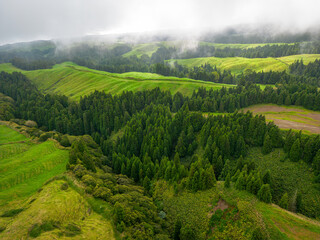 Traditional landscape in the Azores, lush green vegetation around. Aerial View. Sao Miguel, Azores, Portugal. 