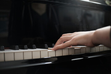 Fototapeta premium Beautiful asian girl learn to play piano.