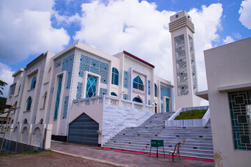 Most Beautiful architecture Model Mosque in Bangladesh with a White cloudy Blue sky