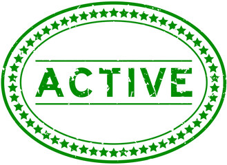 Grunge green active word oval rubber seal stamp on white background