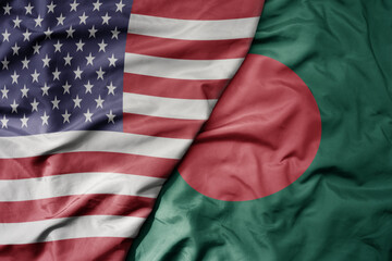 big waving colorful flag of united states of america and national flag of bangladesh .