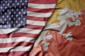 big waving colorful flag of united states of america and national flag of bhutan .