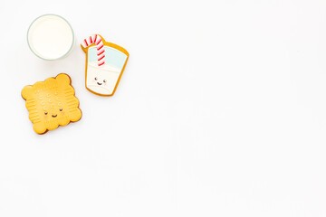 Homemade funny biscuits with milk for kids, top view. Breakfast with milk