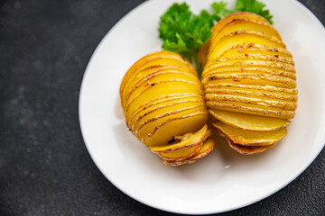 baked potato spicy slice accordion portion vegetable meal food snack on the table copy space food background rustic top view