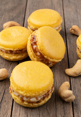 Cashew nut macarons over wooden table