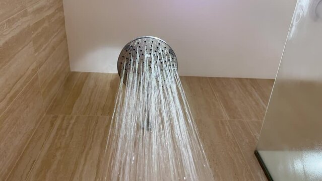 Luxury modern bathroom running shower evaporation steam exhaust air copy space close-up