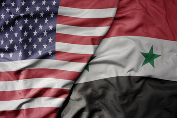 big waving colorful flag of united states of america and national flag of syria .