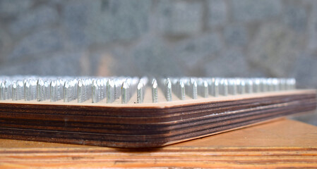 Part of a board with nails for a yoga class close-up.
