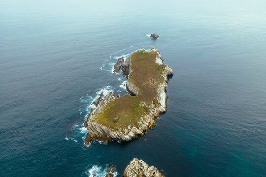 Aerial view of Ilha da Fora island in Baleal along the Ocean coastline in Leiria, Portugal.