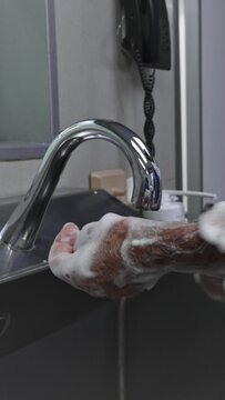 Surgeon man washing hands before operating