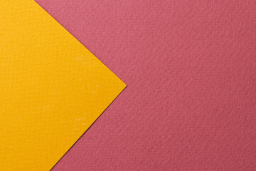 Rough kraft paper background, paper texture red burgundy yellow colors. Mockup with copy space for text.