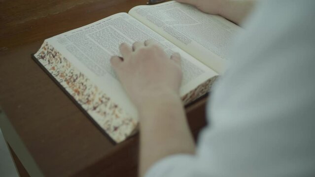 Jewish man read from the Jewish Bible Torah	
