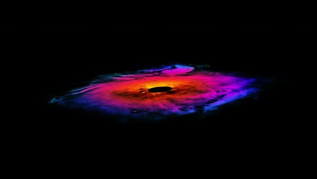 A beautiful multi-colored rotating nebula with a black hole in the center, isolated on a black background. 4k loop video animation. Pattern for a video on the theme of space.