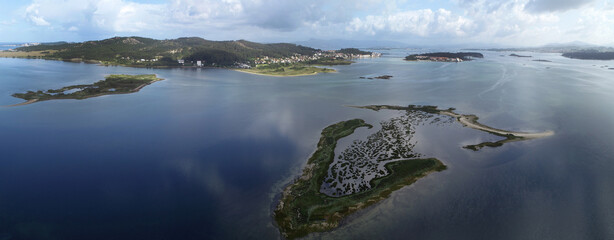 panoramic view of the Ria De Arosa with the Isla de la Toja in the background.