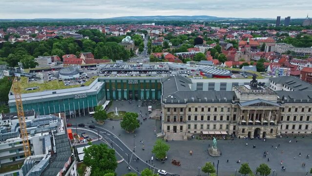 Aerial Drone shot of Schloss-Arkaden Braunschweig . Brunswick Palace or Residenzschloss . Spacious , contemporary mall inside an old castle facade with diverse shops, dining and ample parking . 