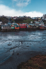 palafitos stilted houses in Castro on chiloe in Chile at low tide
