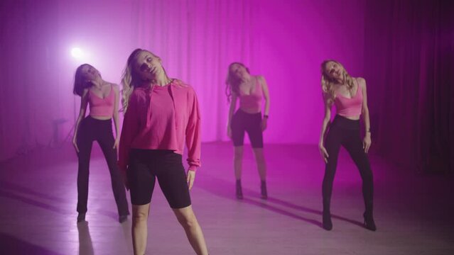 A group of female dancers, led by trainer, begin a class in high heels. Together, they explore a variety of techniques and styles, giving each other the opportunity to embrace their femininity.