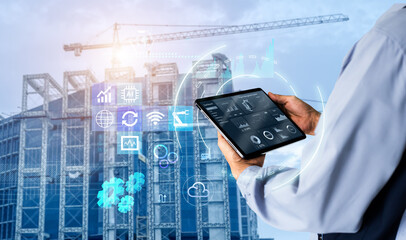 Smart Construction Project management system concept.Hands using digital tablet with Construction Management Software on blurred construction site as background - obrazy, fototapety, plakaty