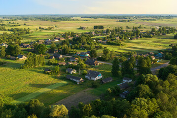 Country houses in countryside. Village Home in Country. Russian village with wooden house. Suburban house in rural. Rural building in countryside. Roofs of village home. Agricultural field at farm.