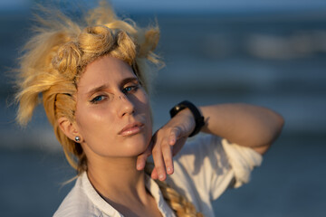 Italian girl cosplay Giorno Giovanna from the anime jojo. Blond woman with blue eyes. Close up to...