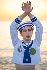 Italian man cosplay Gappy from the anime jojo. Man dressed as a sailor. Blue uniform, amazement.