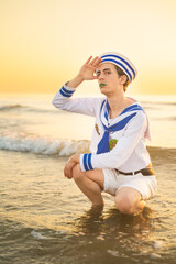Italian man cosplay Gappy from the anime jojo. Man dressed as a sailor. Blue uniform, amazement.