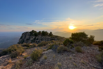 Mountains landscape on sunset. Mountain view from Mola De Segart mountain in Sierra Calderona national park in Valencia, Spain. Sunset over mountains. Landscape of a mountain valley. Hill on sunrise.